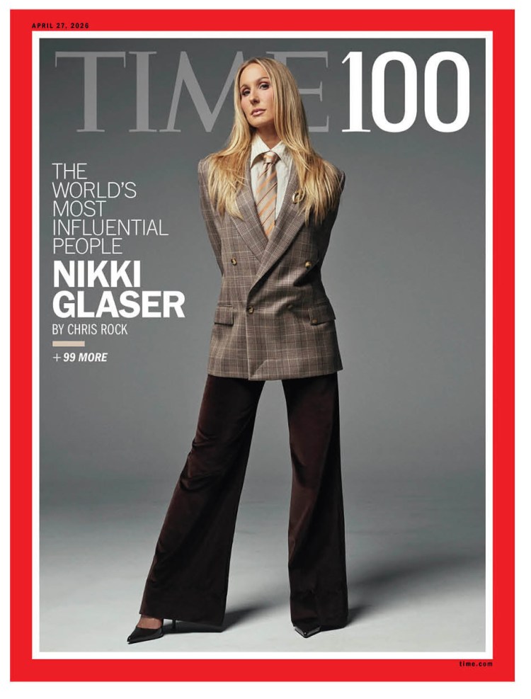 TIME magazine cover featuring Nikki Glaser, dressed in a plaid blazer and tie with wide-leg trousers, highlighting her as one of the world's most influential people.